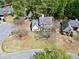 Beautiful aerial view of a two-story home surrounded by lush trees at 1151 Adah Ln, Lawrenceville, GA 30043