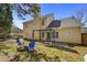 A peaceful backyard with a patio, pergola, and an inviting fire pit at 1151 Adah Ln, Lawrenceville, GA 30043