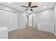 Spacious bedroom includes carpet, closet, ceiling fan, and storage; great for a cozy, organized living space at 1151 Adah Ln, Lawrenceville, GA 30043