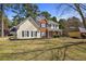 Charming two-story home with a well-manicured lawn and beautiful landscaping at 1151 Adah Ln, Lawrenceville, GA 30043