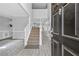 Welcoming foyer with staircase and elegant light fixtures at 1151 Adah Ln, Lawrenceville, GA 30043