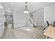 Cozy living room with neutral paint and a decorative light fixture at 1151 Adah Ln, Lawrenceville, GA 30043