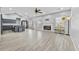 Open-concept living space with seamless flow between kitchen and living room, featuring neutral tones at 1151 Adah Ln, Lawrenceville, GA 30043