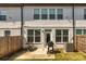 Fenced backyard with small patio perfect for grilling at 228 Auburn Valley Way, Auburn, GA 30011