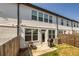 Fenced backyard with small patio perfect for grilling at 228 Auburn Valley Way, Auburn, GA 30011