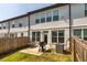 Fenced backyard with small patio perfect for grilling at 228 Auburn Valley Way, Auburn, GA 30011