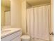 Clean bathroom with a white shower curtain and modern vanity at 228 Auburn Valley Way, Auburn, GA 30011