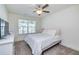 Bright bedroom with natural light, carpet, and a ceiling fan at 228 Auburn Valley Way, Auburn, GA 30011