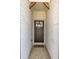 Stylish front door with a window, brick facade, and a decorative 