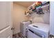 Convenient laundry room with a washer, dryer, and shelving at 228 Auburn Valley Way, Auburn, GA 30011