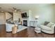 Bright and airy living room with hardwood floors, fireplace, and comfortable seating at 228 Auburn Valley Way, Auburn, GA 30011