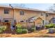 View of the backyard area featuring a fenced yard, patio space, and mature shrubbery on a sunny day at 386 Northdale Ct, Lawrenceville, GA 30046