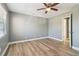 Airy bedroom with hardwood floors, natural light, and a neutral color palette at 386 Northdale Ct, Lawrenceville, GA 30046