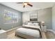 Cozy bedroom featuring large window, neutral tones, and modern decor for a tranquil retreat at 386 Northdale Ct, Lawrenceville, GA 30046