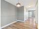 Inviting hallway with modern lighting and wood-look flooring, leading to a bright, welcoming entrance at 386 Northdale Ct, Lawrenceville, GA 30046