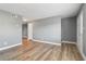 A bright living room with wood floors and view to kitchen and front door at 386 Northdale Ct, Lawrenceville, GA 30046