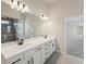 Bathroom with double vanity, tile floors, and a large mirror at 420 Westmarch Cir, Loganville, GA 30052