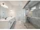 Bathroom features a double vanity, tile floors, and glass shower at 420 Westmarch Cir, Loganville, GA 30052