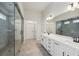 Bathroom with tiled floors, double vanity, and glass enclosed shower at 420 Westmarch Cir, Loganville, GA 30052