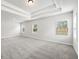 Bright bedroom with large windows and light gray carpet at 420 Westmarch Cir, Loganville, GA 30052