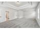 Spacious bedroom with coffered ceiling and light gray carpet at 420 Westmarch Cir, Loganville, GA 30052
