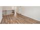 Hallway with wooden floors, bright walls, and entryways to other rooms of the home at 420 Westmarch Cir, Loganville, GA 30052