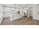 Bright kitchen with quartz countertops, stainless appliances, and white cabinets at 420 Westmarch Cir, Loganville, GA 30052