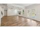 Spacious living room with fireplace, coffered ceiling, large windows, and hardwood floors at 420 Westmarch Cir, Loganville, GA 30052