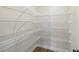 Spacious pantry closet features built-in shelving for organization and storage at 420 Westmarch Cir, Loganville, GA 30052
