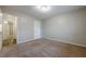 A spacious bedroom with plush brown carpet, light walls, and an open doorway inviting warmth and comfort at 1010 Scott Blvd # D8, Decatur, GA 30030