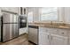 Modern kitchen with stainless steel appliances, granite counters, and ample cabinet space at 1010 Scott Blvd # D8, Decatur, GA 30030