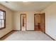 Bedroom with neutral carpeting and access to other rooms at 1924 Sidneys Cv, Lawrenceville, GA 30043