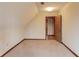 Upstairs bedroom with vaulted ceilings and access to the hallway at 1924 Sidneys Cv, Lawrenceville, GA 30043