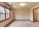 Bedroom with a large window and neutral carpet at 1924 Sidneys Cv, Lawrenceville, GA 30043
