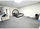 Spacious carpeted bedroom with a walk-in closet and ample natural light at 1924 Sidneys Cv, Lawrenceville, GA 30043