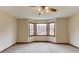 Spacious bedroom with bay window offering great natural light and a ceiling fan at 1924 Sidneys Cv, Lawrenceville, GA 30043