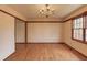 Dining room featuring hardwood floors and chandelier lighting at 1924 Sidneys Cv, Lawrenceville, GA 30043