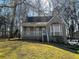 Charming home with a covered front porch, bay window, and well-maintained lawn at 1924 Sidneys Cv, Lawrenceville, GA 30043