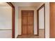 Hallway showing a paneled closet door and wood trim at 1924 Sidneys Cv, Lawrenceville, GA 30043