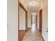 Hallway featuring neutral walls, wood trim, and flooring at 1924 Sidneys Cv, Lawrenceville, GA 30043