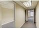 Neutral hallway with multiple doorways, carpet, and a view into additional rooms at 1924 Sidneys Cv, Lawrenceville, GA 30043