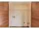 Laundry room with white walls, utility connections, and a wire shelf at 1924 Sidneys Cv, Lawrenceville, GA 30043