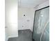 Laundry room with white walls, gray floor and hook-ups for a washer and dryer at 1924 Sidneys Cv, Lawrenceville, GA 30043