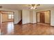 Open-concept living space with hardwood floors and staircase at 1924 Sidneys Cv, Lawrenceville, GA 30043
