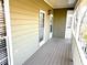 Cozy porch featuring neutral siding and natural light at 1924 Sidneys Cv, Lawrenceville, GA 30043
