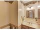 Charming powder room features floral wallpaper border, decorative mirror, and traditional fixtures at 1924 Sidneys Cv, Lawrenceville, GA 30043
