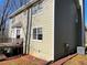 Rear exterior view featuring a deck, siding, and an attached garage at 1924 Sidneys Cv, Lawrenceville, GA 30043