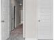 A hallway with gray carpeting and white doors at 317 Skye Ln # 51, Cartersville, GA 30121