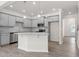 Bright kitchen with gray cabinets, granite countertops, stainless appliances, and an island for extra prep space at 317 Skye Ln # 51, Cartersville, GA 30121