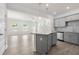 Open concept kitchen with gray cabinets, granite countertops, stainless appliances, and spacious dining area at 317 Skye Ln # 51, Cartersville, GA 30121